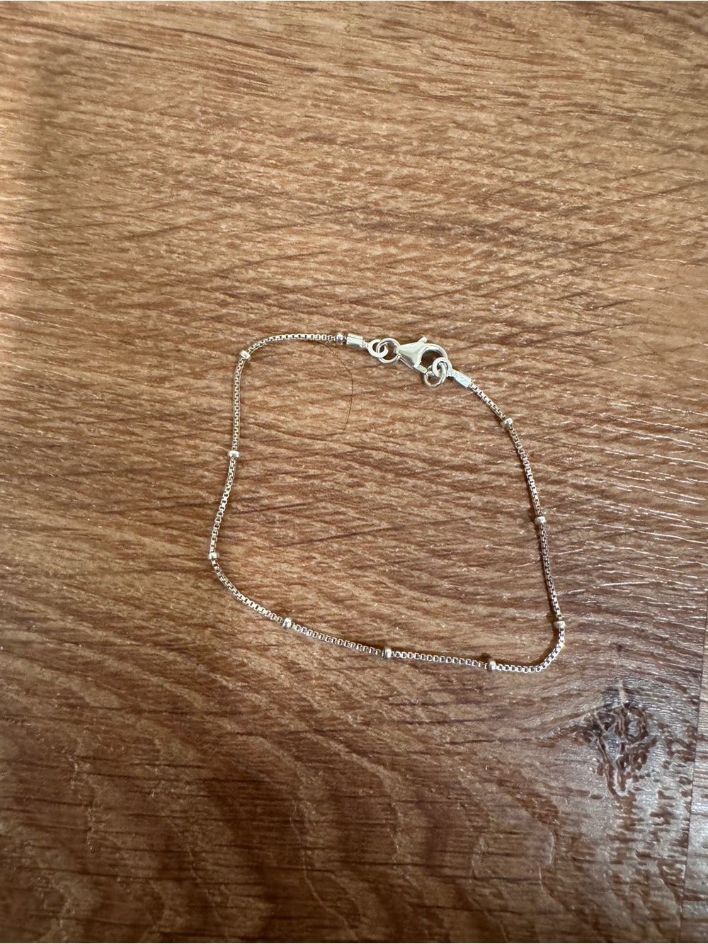 Silver toned satellite bracelet